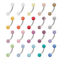 Bunte Titan Bananabells mit Kristallen Verschiedene bunte Bananabells aus Titan mit Kristallen auf weißem Hintergrund