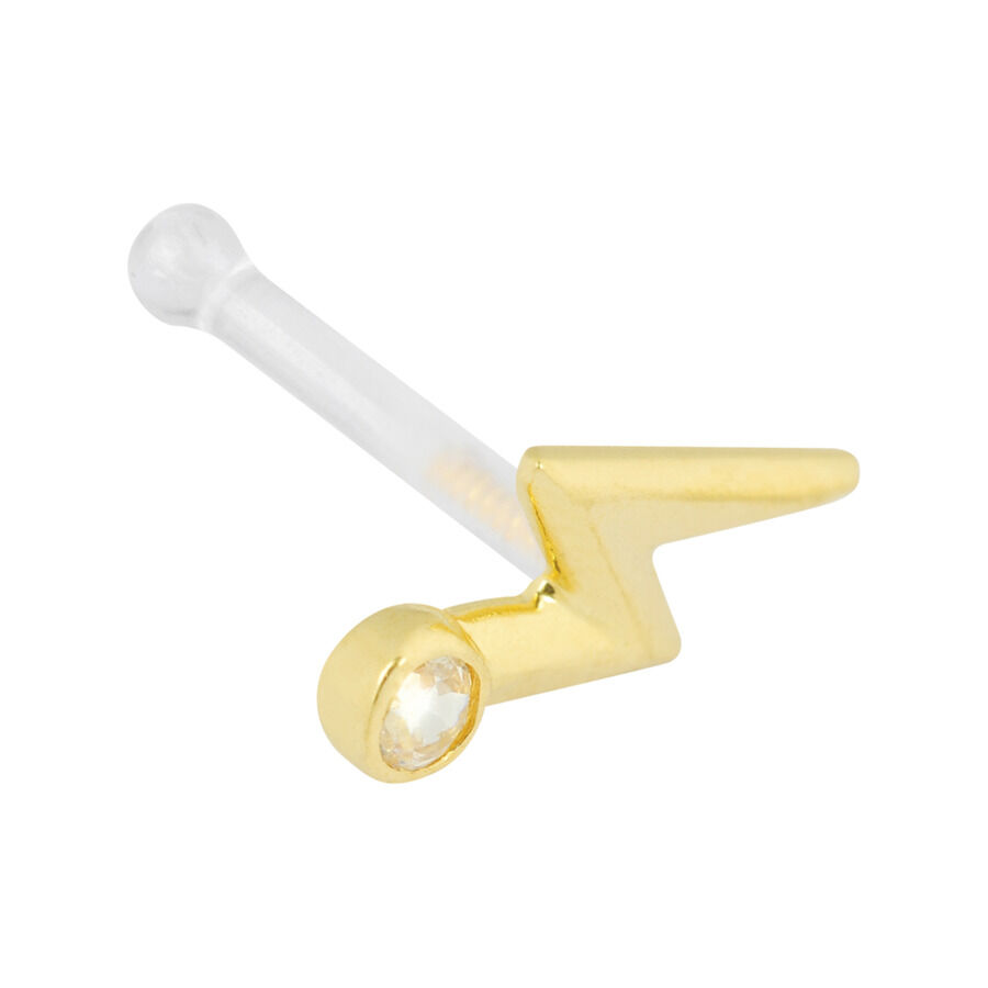 Piercing nasale dorato con forma a fulmine e cristallo chiaro su sfondo bianco