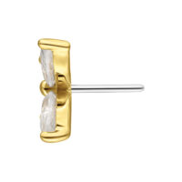 Attacco a farfalla dorato con cristalli chiari su sfondo bianco